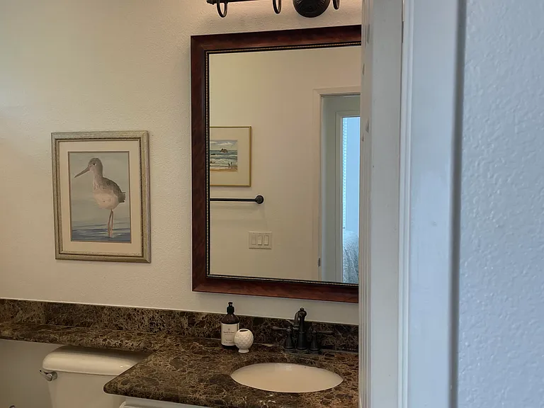 Artwork, bath mat, rugs, and towels included.
