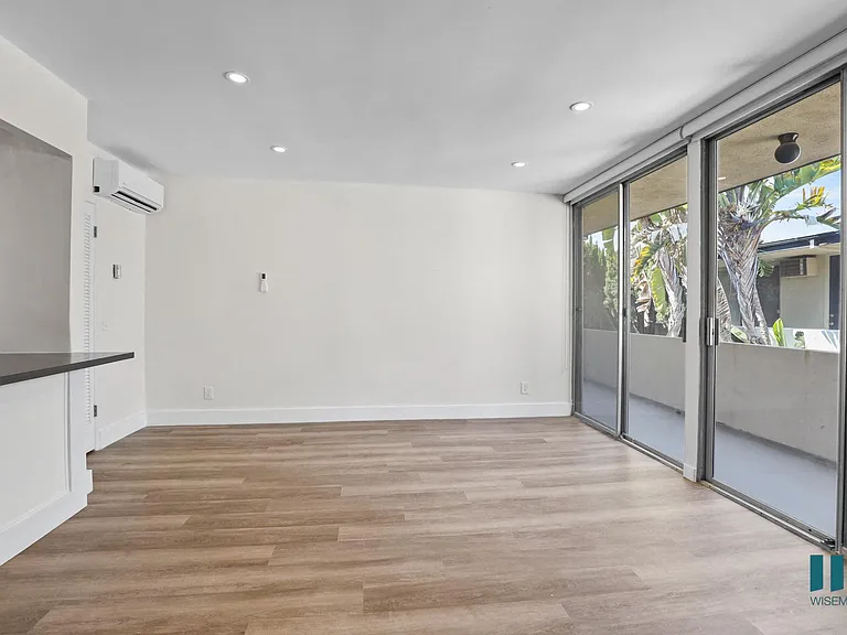 Living Room with Sliding Glass Doors Leading to Balcony
