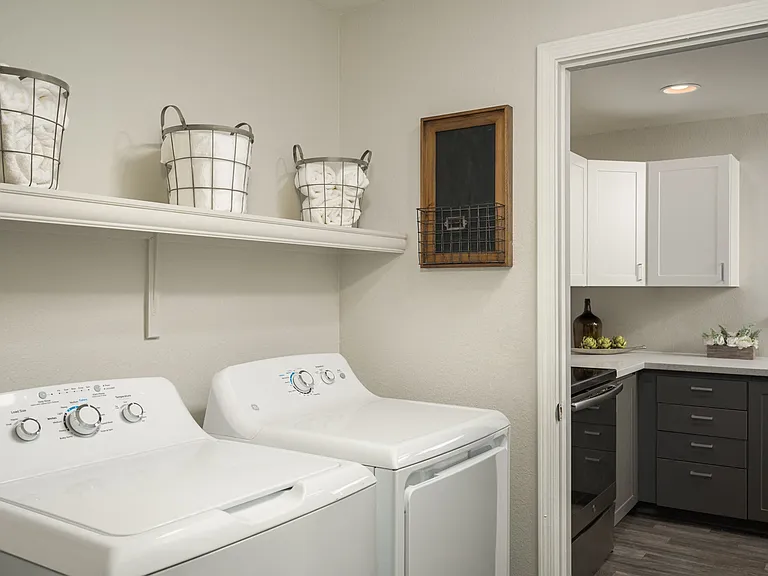 Dedicated laundry room off the kitchen at Trevi Apartment Homes