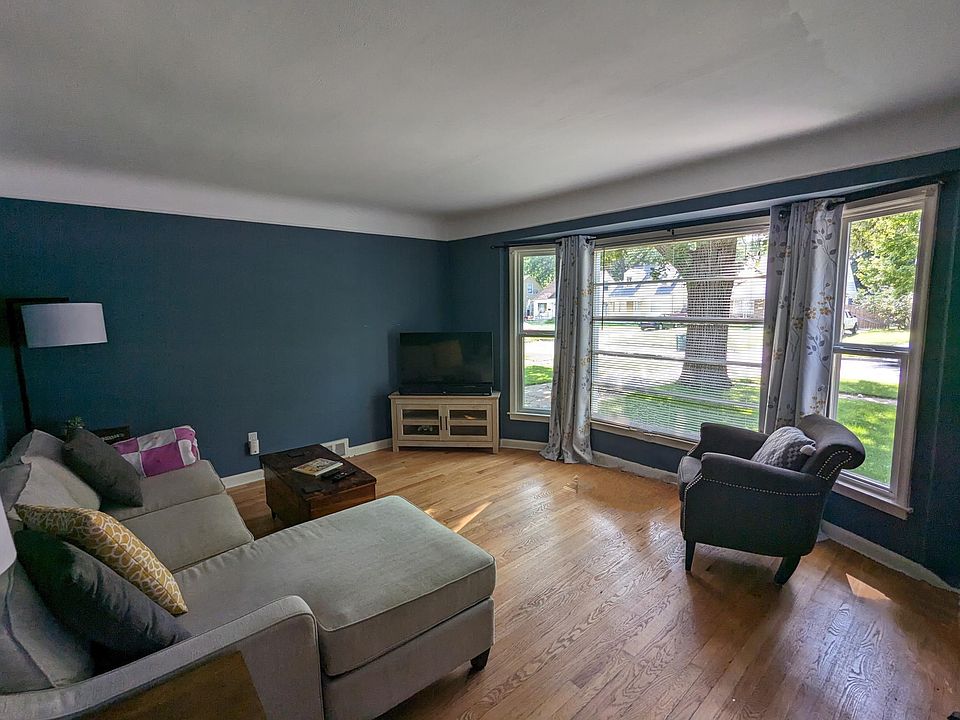 Large windows overlooking the front yard and mature tree. 

*Furniture not included. Rental is unfurnished.