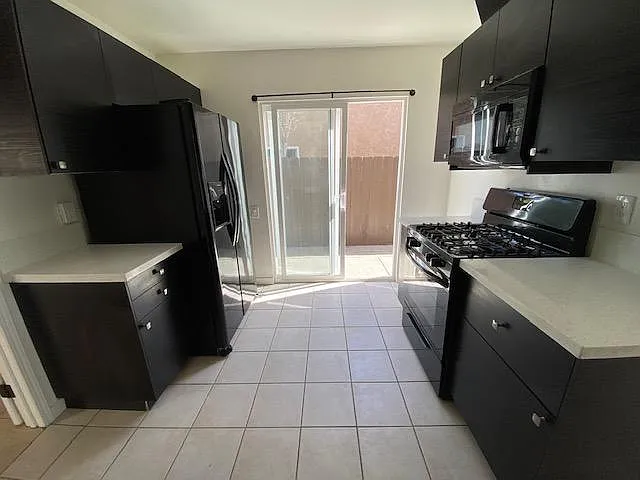 Gas range, microwave, kitchen opens to side patio