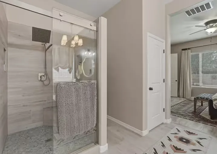 Privacy, comfort, and style all in one bedroom with a full bath and vanity.