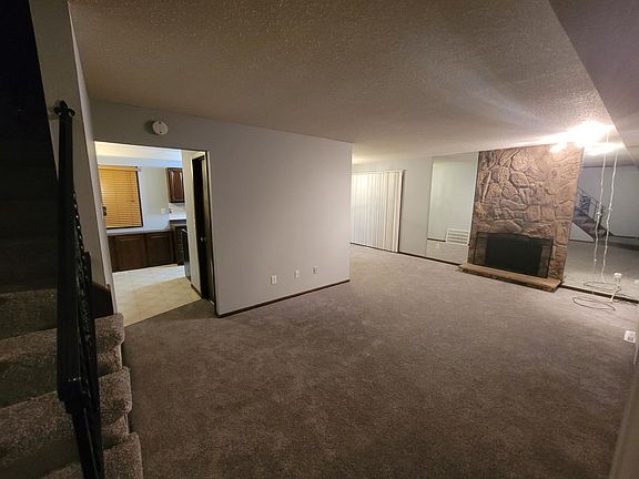 Middle level, kitchen, half bathroom, front door entrance, side patio and main patio entrance.