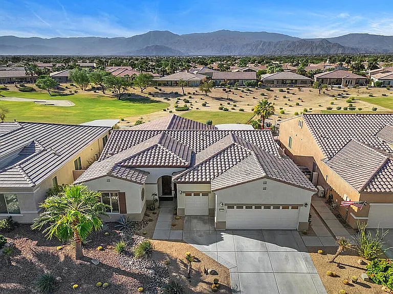 House includes golf cart garage