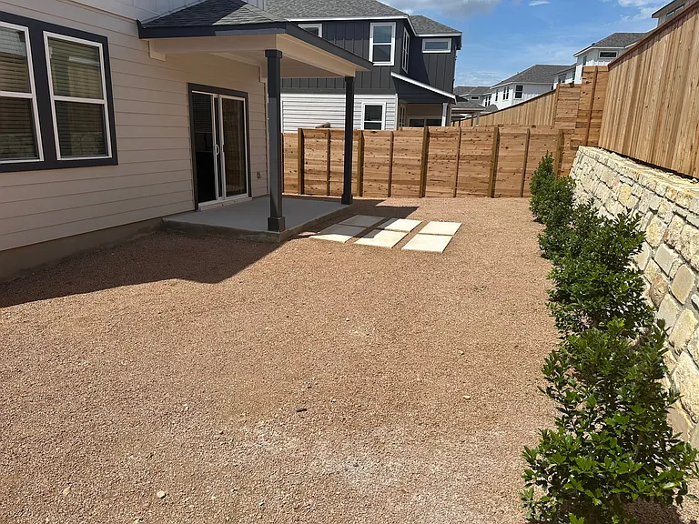 Backyard with covered patio and xeriscape landscaping
