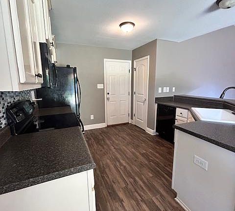 Newly updated kitchen sink with cup rinser and backsplash