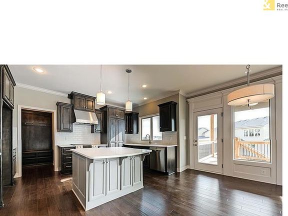 Kitchen includes: Granite counter tops, Kholer brushed nickel kitchen faucet with integral sprayer, Bosch stainless steel appliances: range, dishwasher, microwave. Concealed cabinet door hinges, Soft-close drawers with designer pulls, and USB charging out