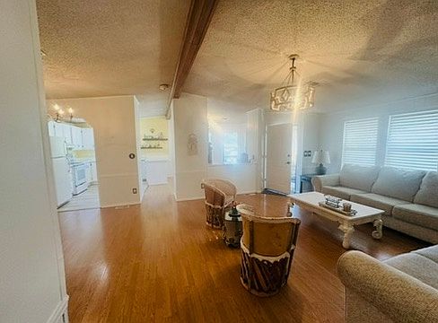 View from hallway. Seeing the front door, living room to the right, dining room to the left, and kitchen and large kitchen nook straight ahead.