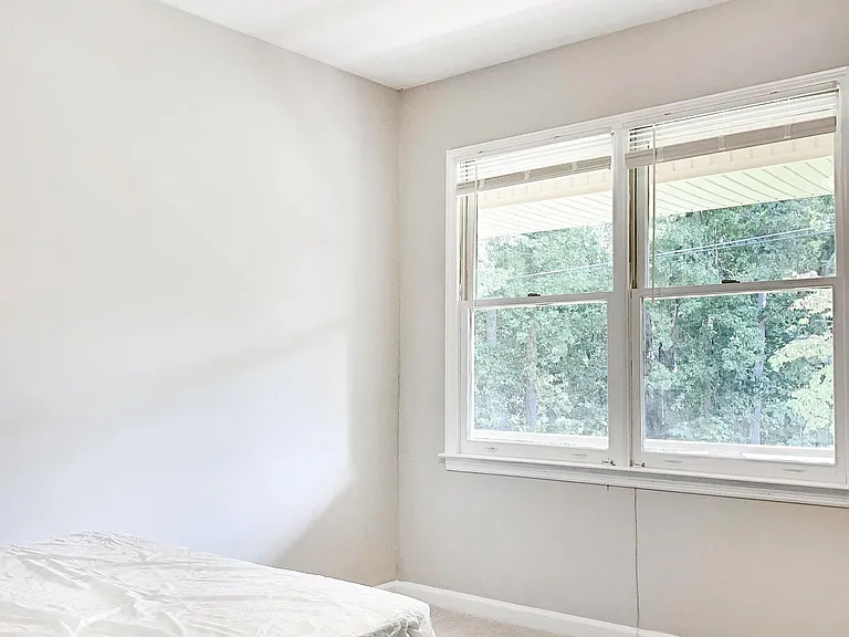 Dual windows in this bright bedroom!