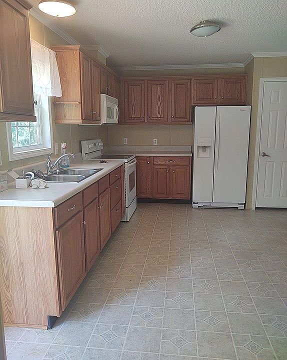 Well lit good size kitchen
