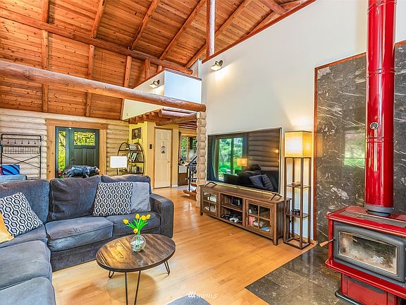Living room with statement wood stove.>