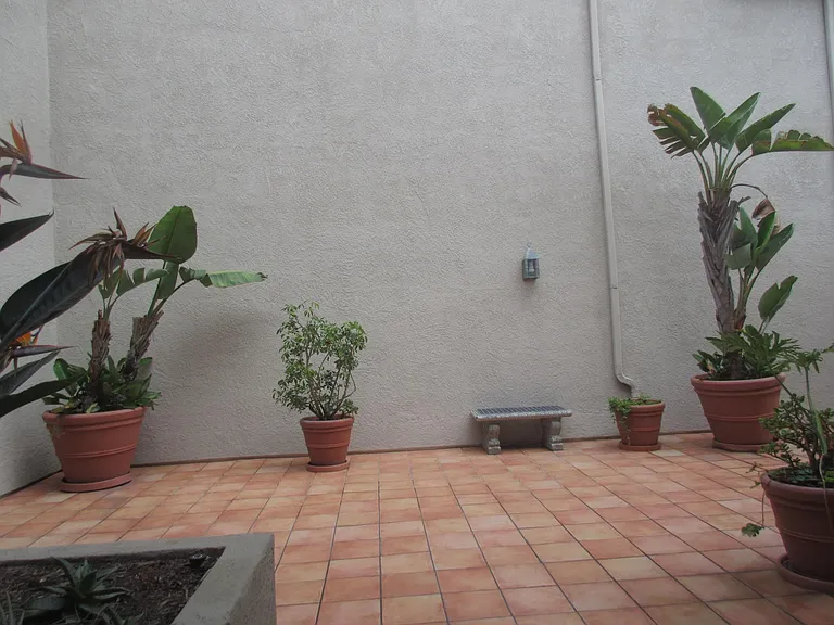 BEHIND Secured GATE : View of QUIET courtyard from YOUR FURNISHED Guest bedroom ... newer double-panned window.