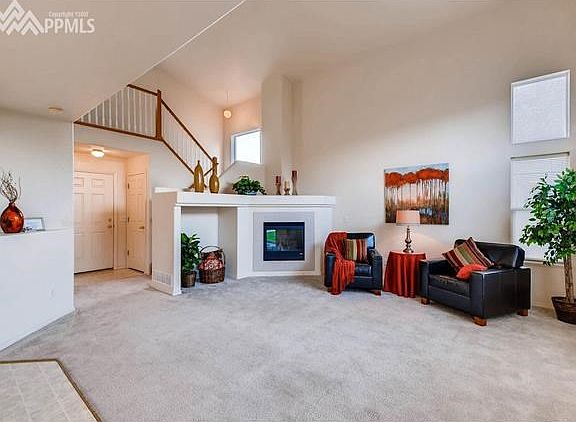 Vaulted Ceilings and large windows make this living room a light, bright area for your family