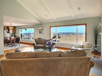 Living Room with huge view windows, looking toward Olympic Mountains