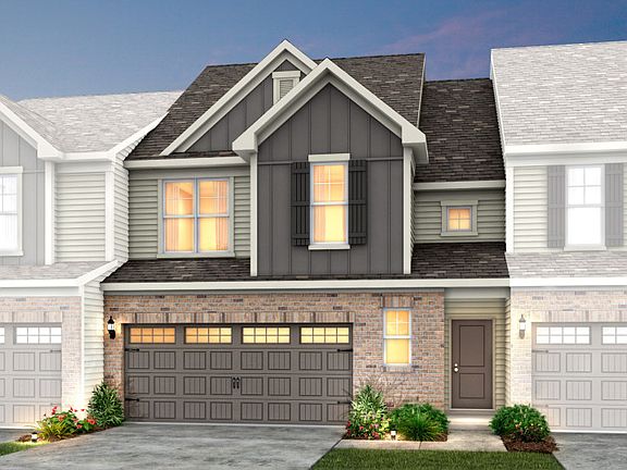 Palomino Exterior 8 features siding, brick, covered front door and 2 car front load garage