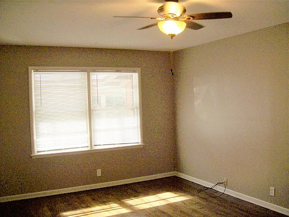 Living Room has double windows overlooking backyard with har