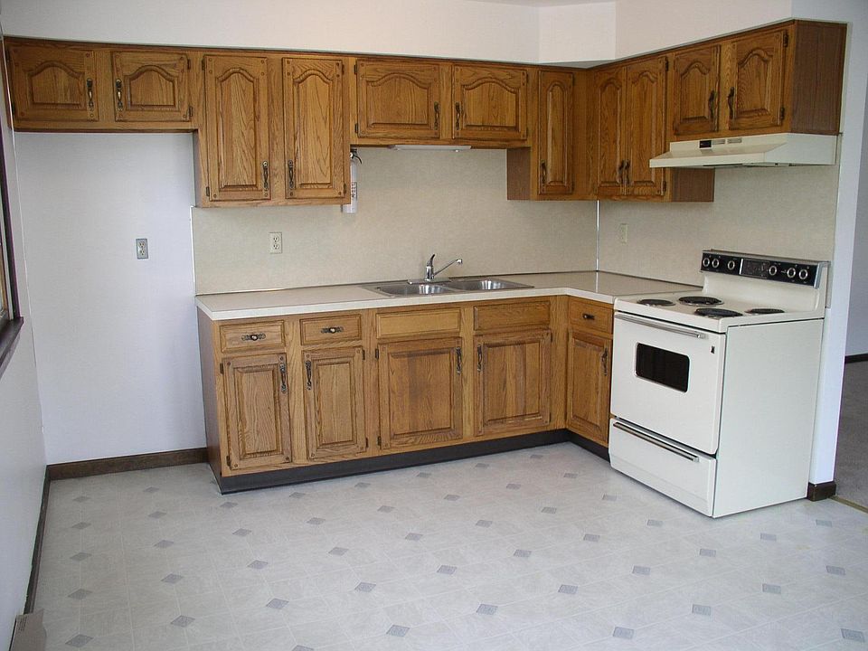 Kitchen 15'X15' there is a ceiling fan and light. Deck is off the kitchen and kitchen is open to the living room on the right. There is a newer stove / oven unit and microwave unit with exhaust fan that is vented outside.- not the one pictured here.