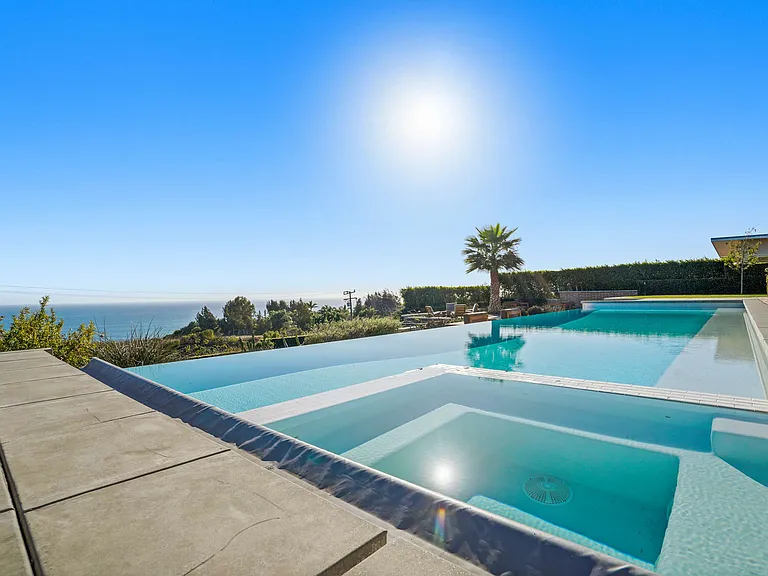 Relax poolside with nothing but ocean on the horizon.