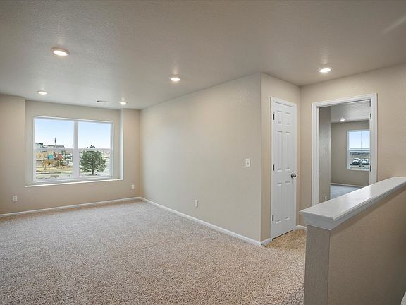 This home includes a loft perfect for some extra space for a home office or a space for the kids.
