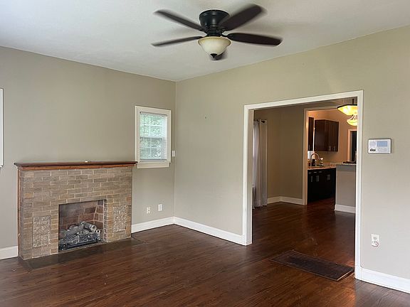 Front living room. Dining room and kitchen are through the cased opening. Hardwoods throughout.