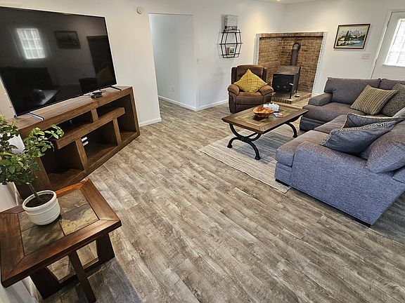 Family room with 70-inch TV.
