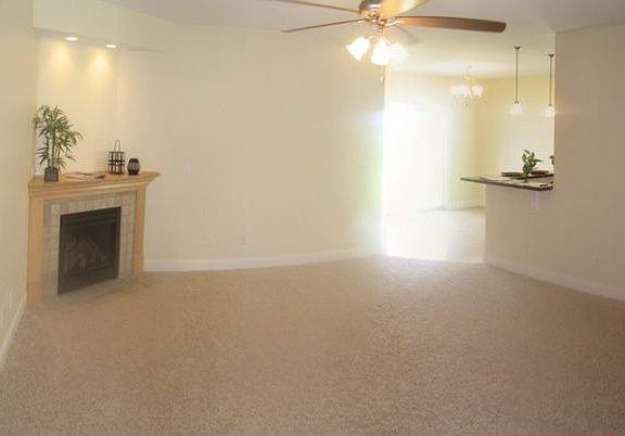 Open living room w/corner fireplace