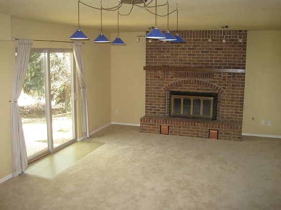 Family room with fireplace, walkout to patio