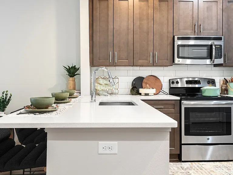 Modern Kitchen with Stainless Steel Appliances and Dark Wood Cabinets