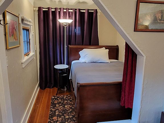 Bedroom nook with full size bed, rear closet