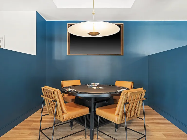 Game room with poker table.