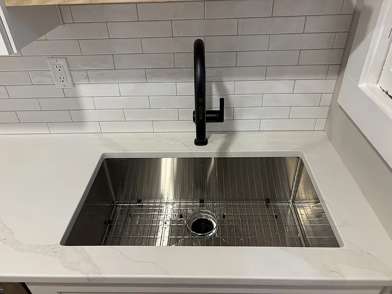 Deep stainless sink with disposal