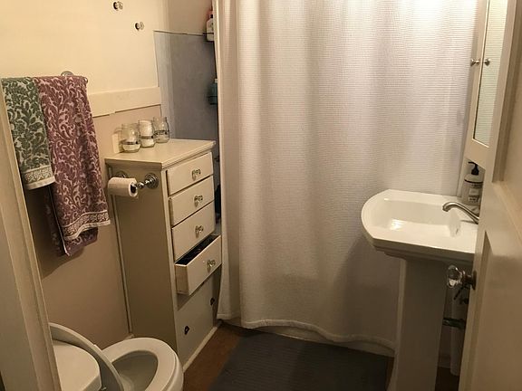 Full bath with pedestal sink and original built-ins (and a l