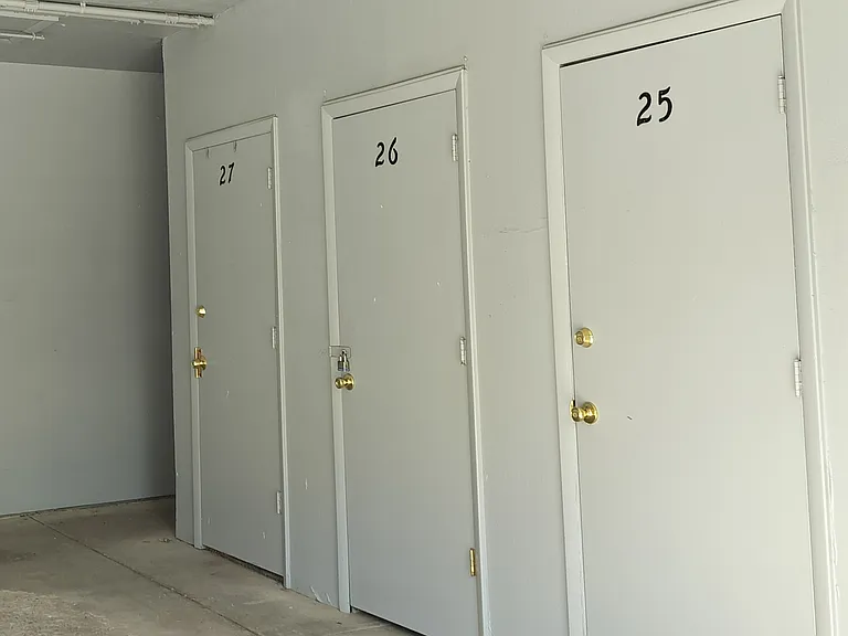 Locked storage area with shelving