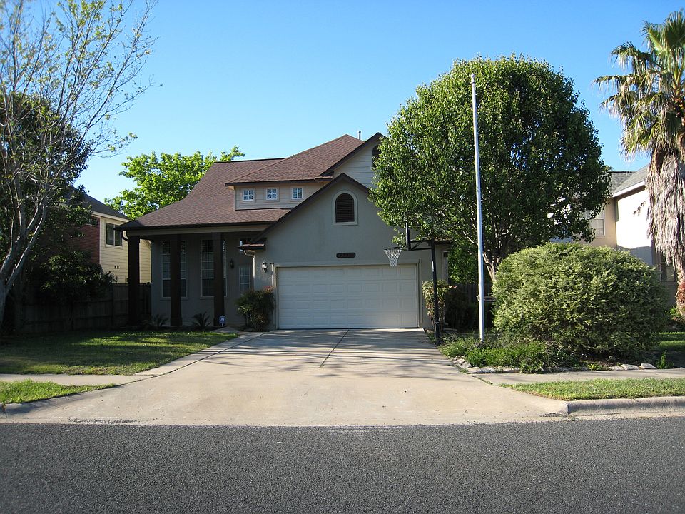 Entry is on tree lined street.