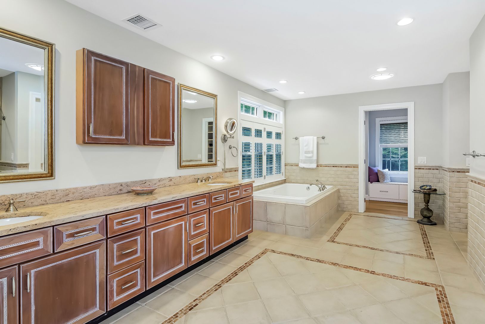  Primary en suite bathroom with separate shower stall, jetted tub and walk-in closet