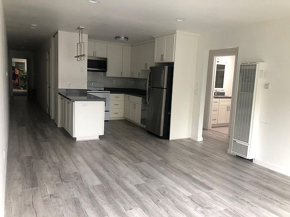 View from living area; dimmable, recessed lighting throughout common area