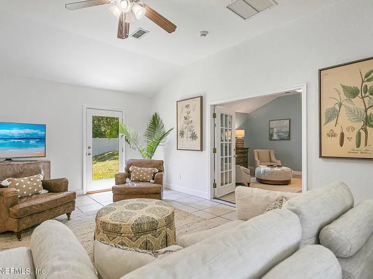 Bonus living room (back of the house). Includes exterior doors to backyard and front yard.