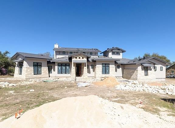 Construction photo taken late February 2016. When completed, the yard will be beautifully landscaped with a sparkling swimming pool overlooking the dedicated greenbelt!