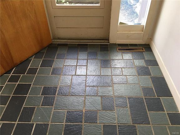 Impeccable slate floor in foyer.