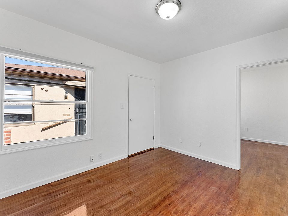 Living Room looking at Front Door and Bedroom Entrance