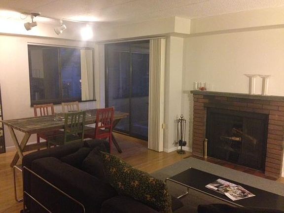 living room with a functioning fireplace