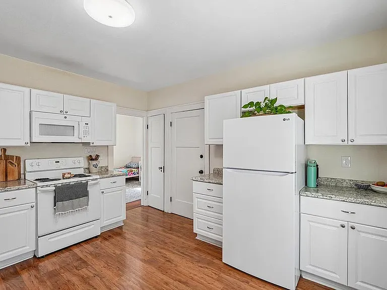 Roomy kitchen with tons of storage and south facing windows. LG fridge and dishwasher.