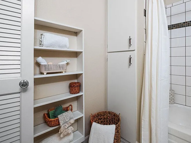 Floor to ceiling linen cabinet and shelving unit for storage in the bathroom