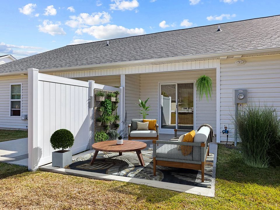Back yard and patio, virtually staged.

This image for representation purpose only. Townhouse is not furnished.