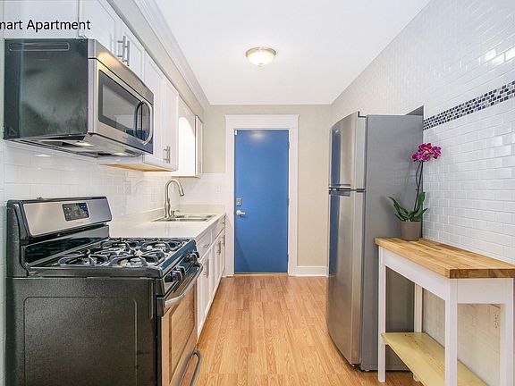 Modern Galley Kitchen, Dental Molding, Stone Counters, Stainless Steel Apliance, Custom Tile.