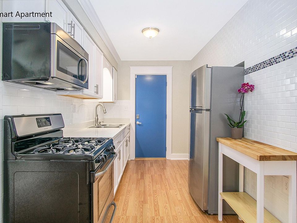 Modern Galley Kitchen, Dental Molding, Stone Counters, Stainless Steel Apliance, Custom Tile.