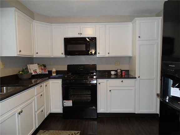What's not to love about this kitchen? NEW everything - cabinets with soft-close drawers, granite co