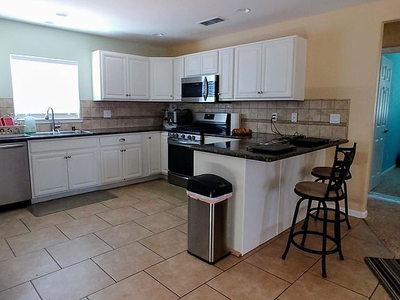 Kitchen- includes stove, microwave, and dishwasher. Does not include barstools, garbage can, or refrigerator.