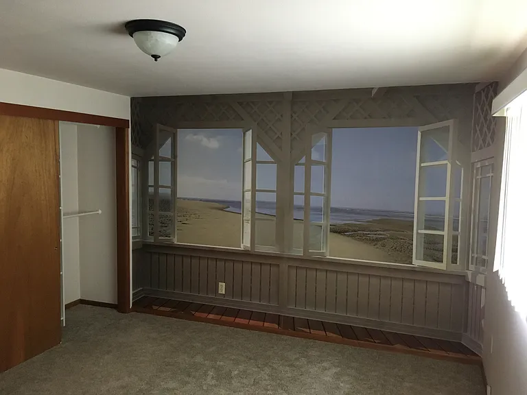 Master bedroom with mural of Washington Coast