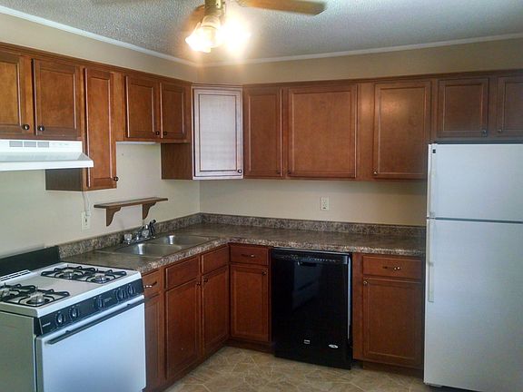 Eat-in kitchen with range, refrigerator, and dishwasher, large windows, pantry